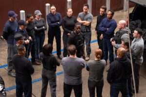 Xavier (Sterling K. Brown) stands in the middle of a circle of secret service agents as they prepare to revolt in Paradise