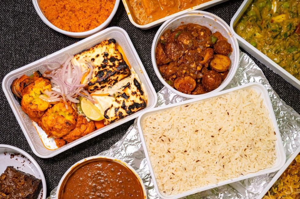 Indian food takeout in plastic containers