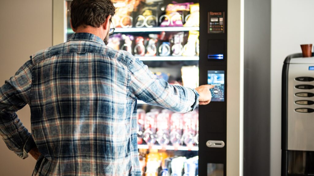 man using a vending machine