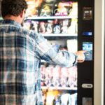 man using a vending machine