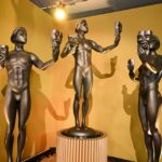 SAG Awards statuettes displayed on a pedestal, featuring the classic actor holding comedy and tragedy masks.