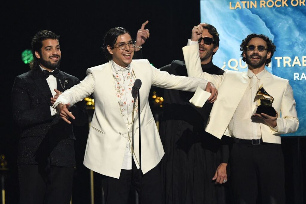 Venezuelan band Rawayana celebrate winning the Grammy for Latin Rock or Alternative Album "Â¿QuiÃ©n trae las cornetas?" during the 67th Annual Grammy Awards pre-telecast show at the Crypto.com Arena in Los Angeles on February 2, 2025. (Photo by VALERIE MACON / AFP) / RESTRICTED TO EDITORIAL USE (Photo by VALERIE MACON/AFP via Getty Images)