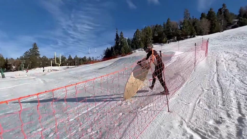 The professional surfer snuck under a fence to re-enter the mountain to surf the slope.