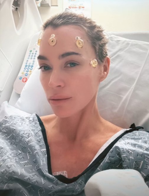 Teddi Mellencamp in a hospital bed, undergoing medical treatment.