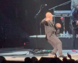 Billy Joel falling on stage while performing.