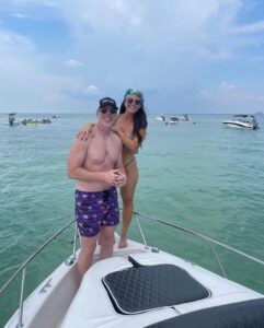 David Cannon and his fiancée on a boat.