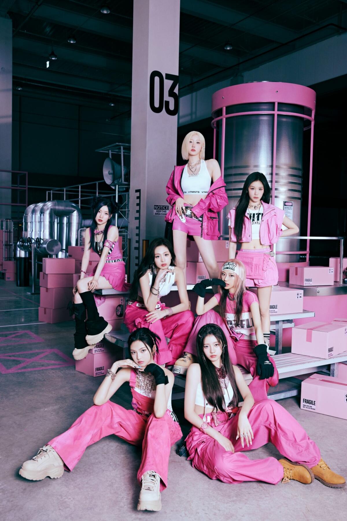 Portrait of a K-pop group all dressed in pink