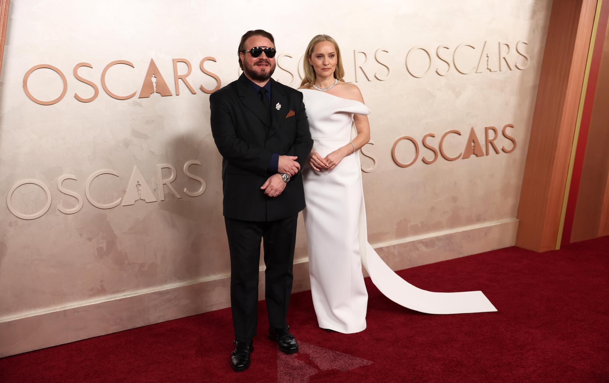 Brady Corbet and Mona Fastvold pose on the red carpet (Allen J. Schaben / Los Angeles Times)