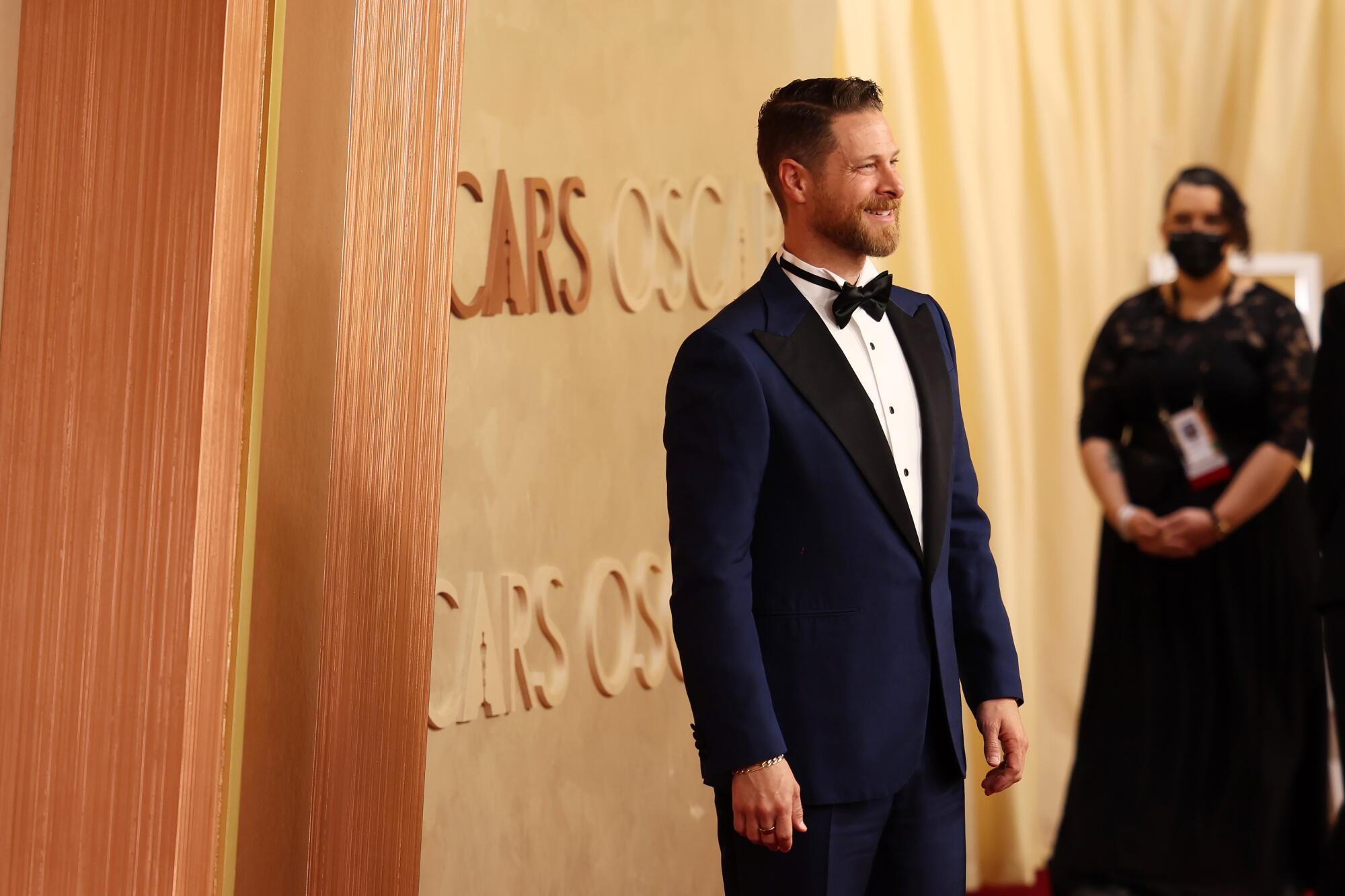 D.J. Gugenheim, producer for "The Brutalist," is tux ready on the red carpet.