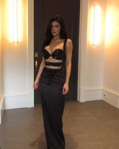 Woman in a black, beaded gown.