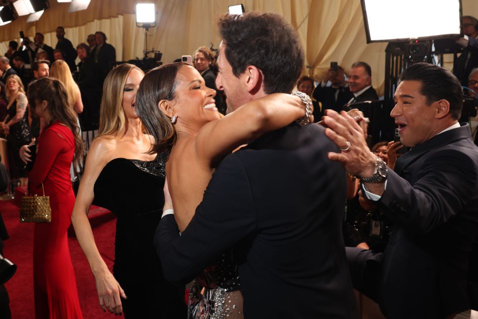 Halle Berry embracing Adrien Brody at the Academy Awards.