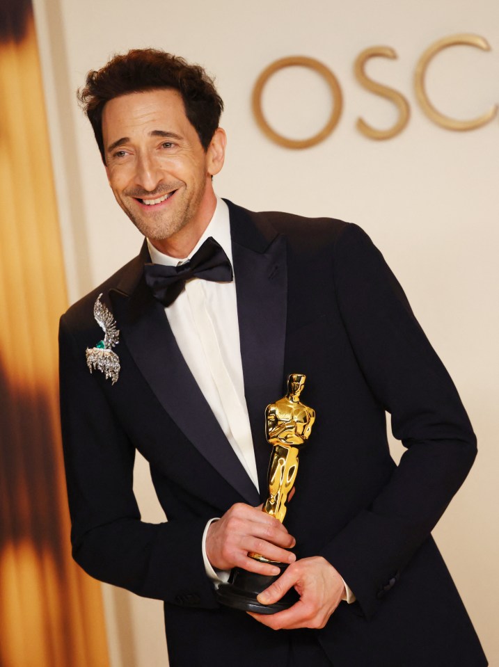 Adrien Brody holding his Oscar for Best Actor.