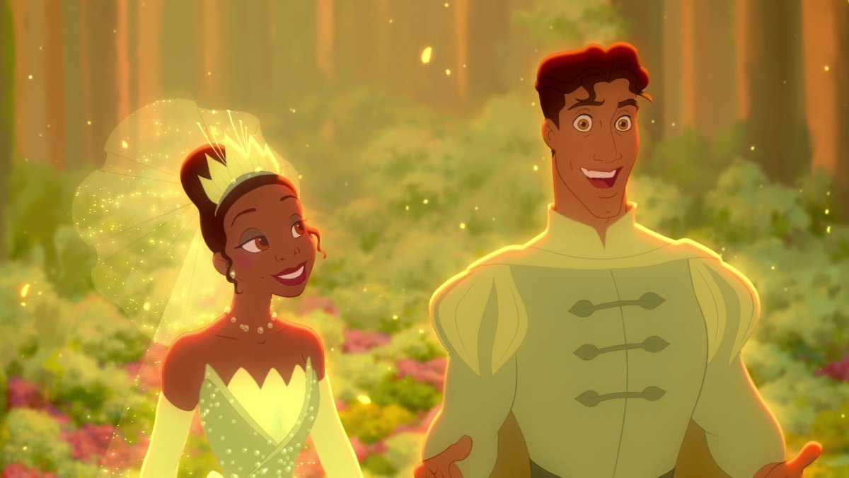 Princess Tiana and Prince Naveen in the forest in royal green clothing.