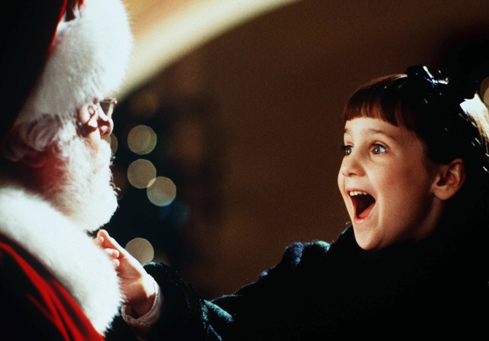 Mara Wilson and Richard Attenborough in a scene from *Miracle on 34th Street*.