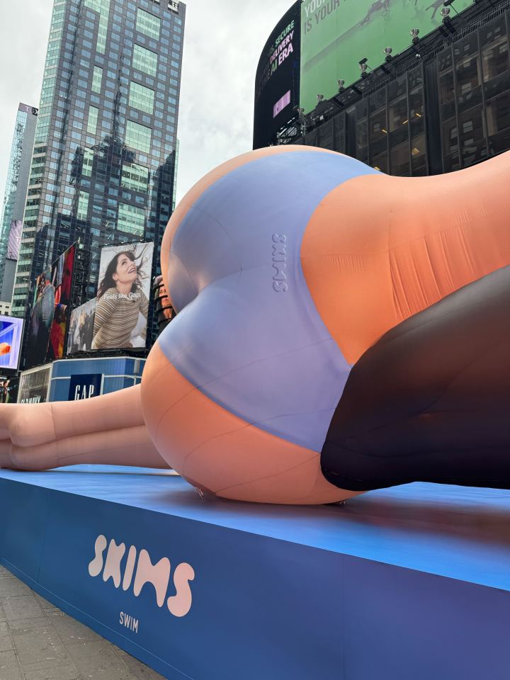 Large inflatable Skims swimsuit in Times Square.