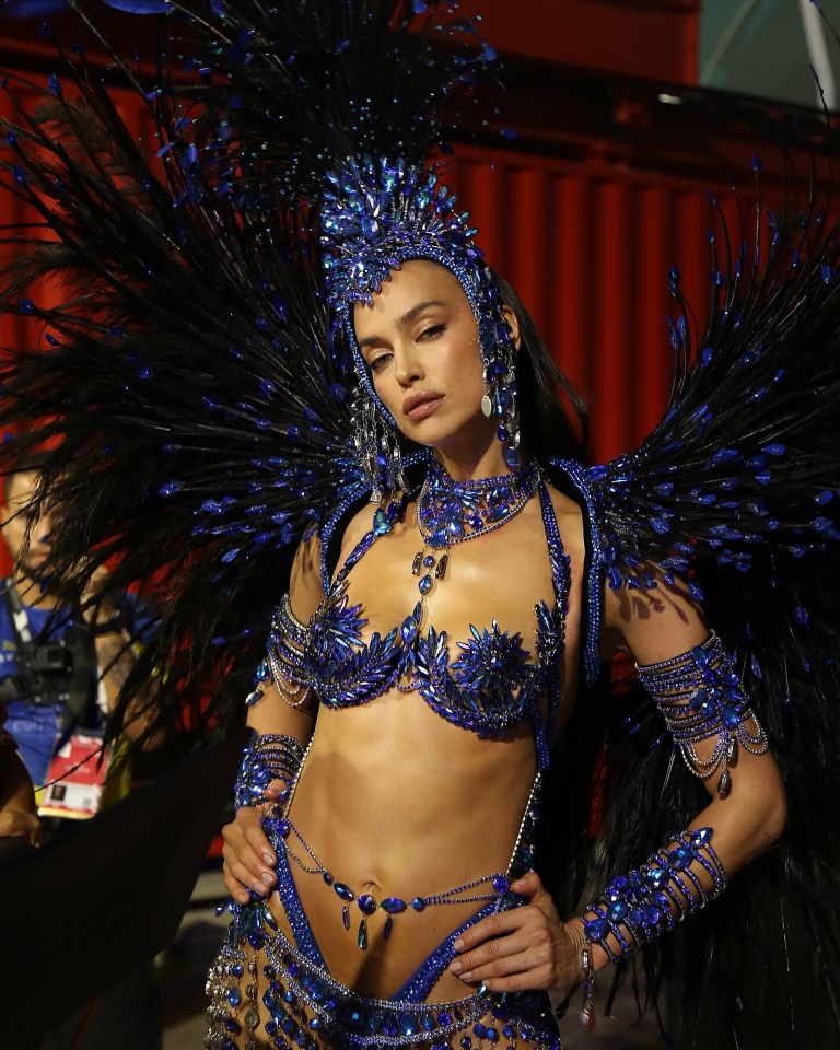 Woman in elaborate blue and black Brazilian carnival costume.