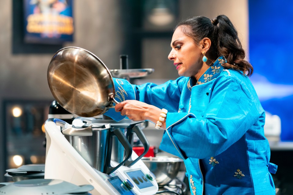 Maneet Chauhan, a contestant on Food Network's Tournament of Champions, using kitchen equipment.