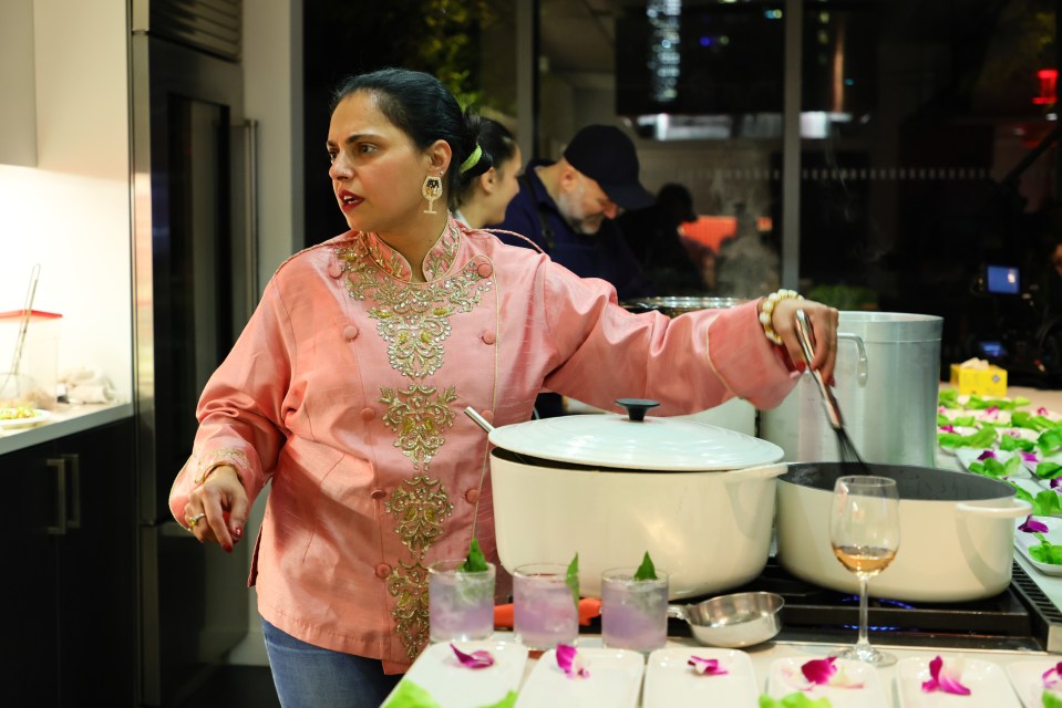 Maneet Chauhan cooking at a food festival.