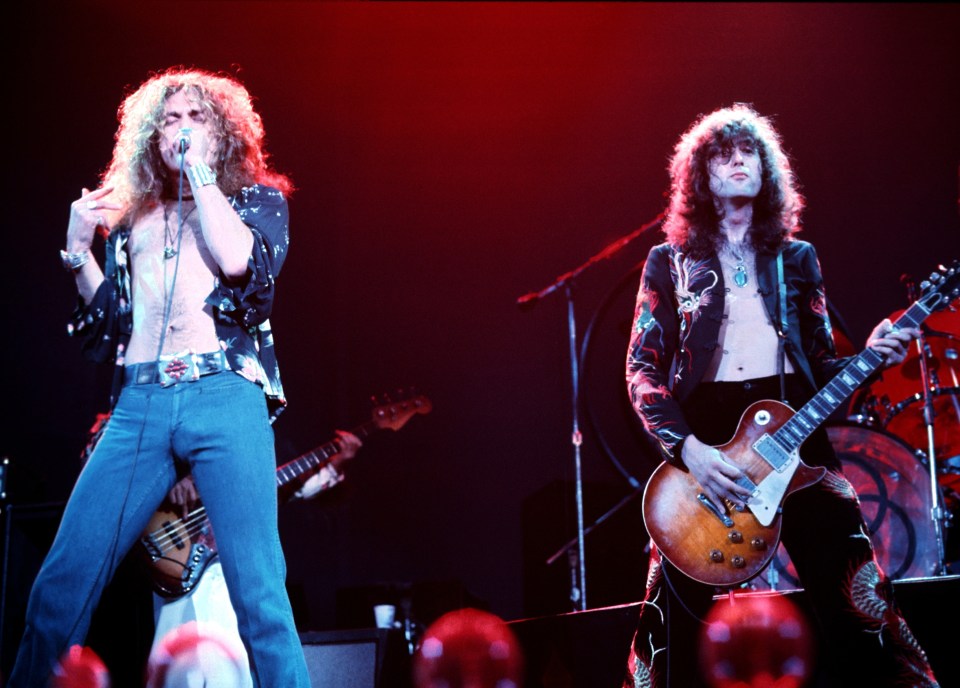 Robert Plant and Jimmy Page of Led Zeppelin performing on stage.