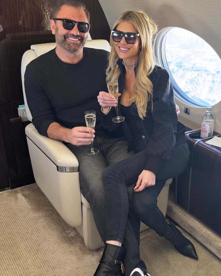 Couple enjoying champagne on a private jet.