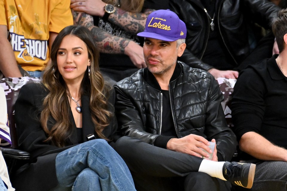 Jessica Alba and Cash Warren at a Lakers basketball game.