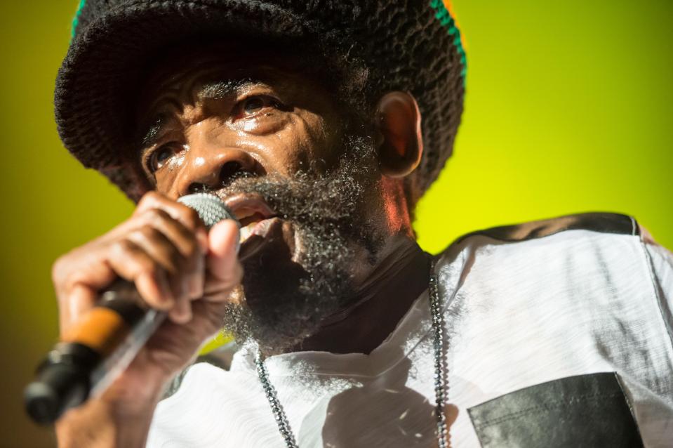 Cocoa Tea performing live at a concert.