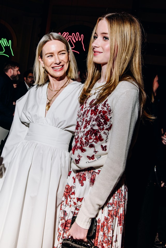 Naomi Watts and her daughter at a Dior fashion show.