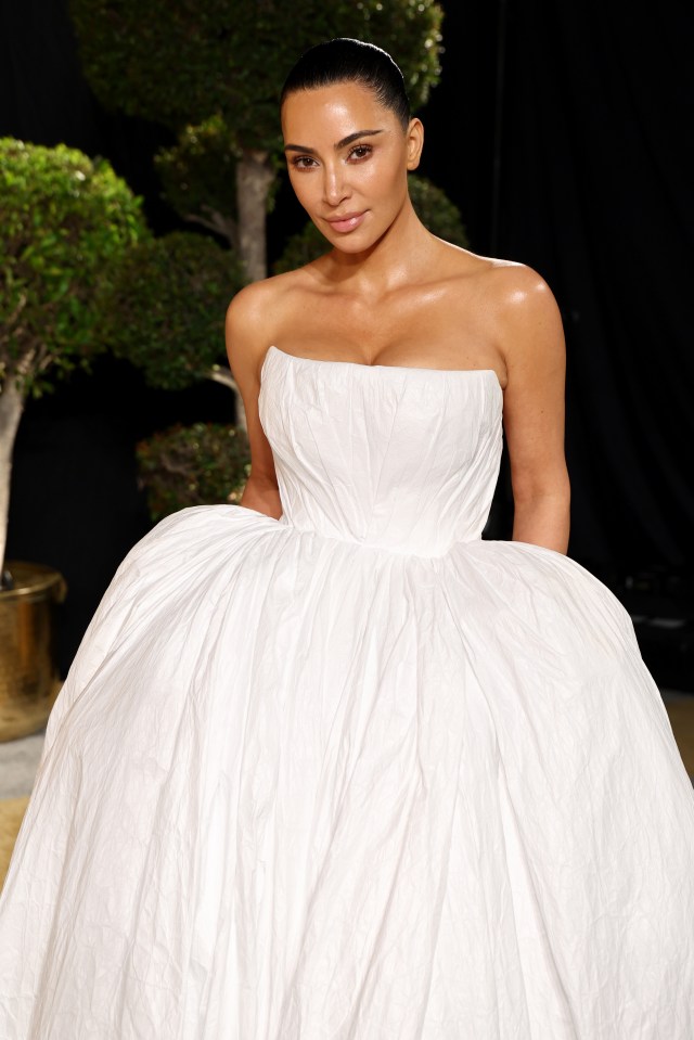 Kim Kardashian at the Vanity Fair Oscar Party in a white gown.