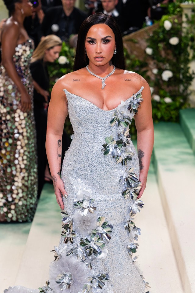 Demi Lovato at the Met Gala in a silver sequined gown.