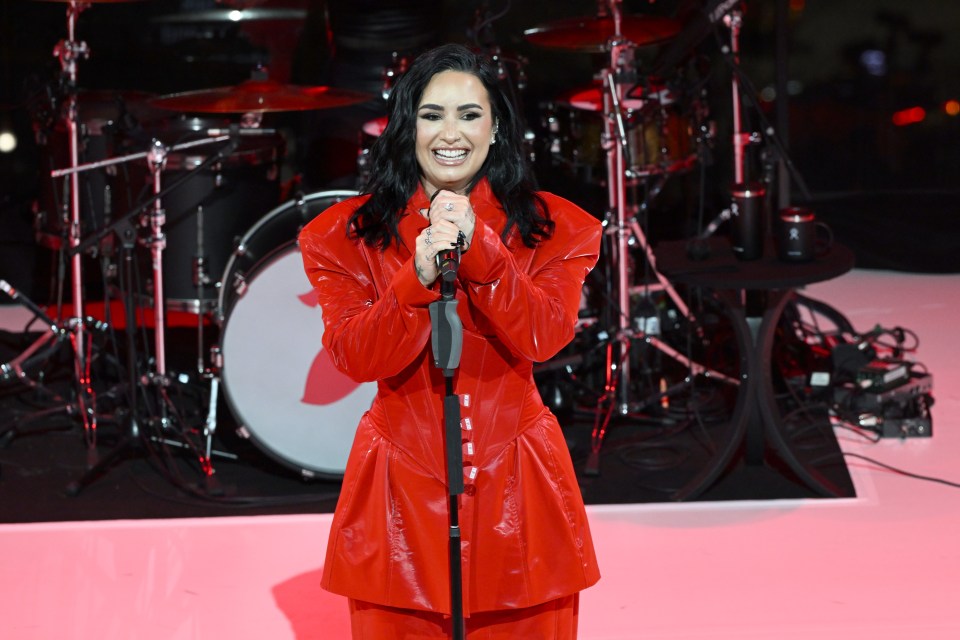 Demi Lovato performing at a concert.