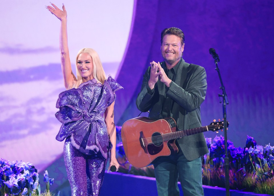 Gwen Stefani and Blake Shelton performing on stage.