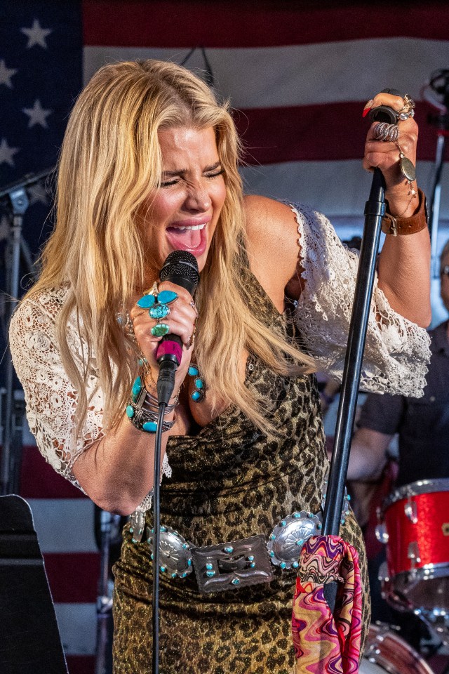 Jessica Simpson performing at a concert.