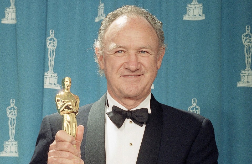 Gene Hackman holding an Academy Award.