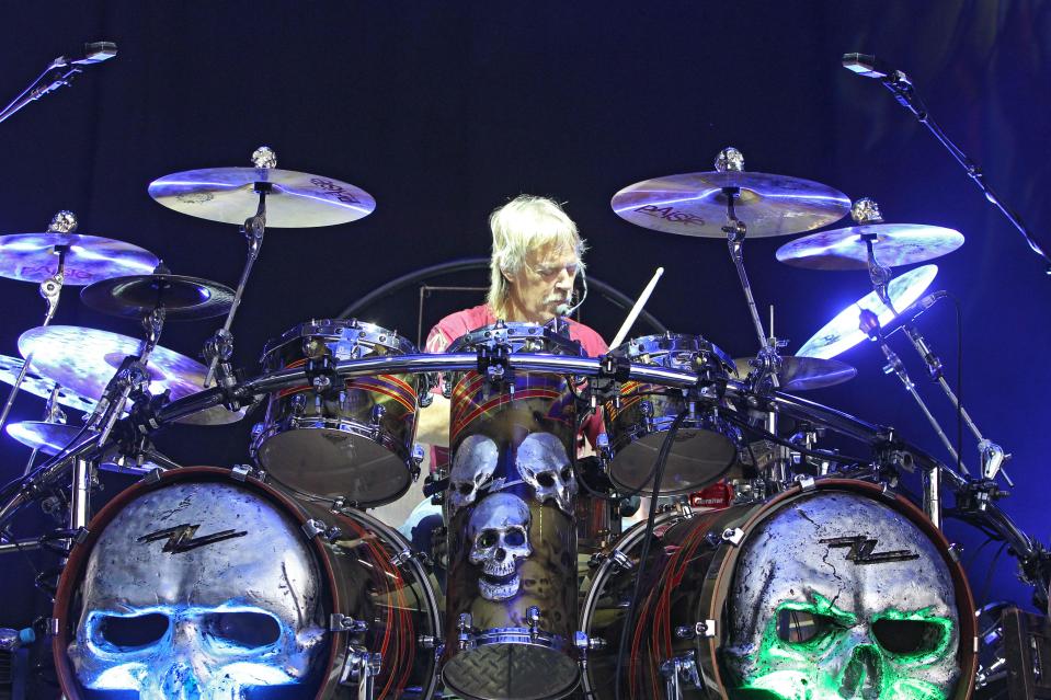 Frank Beard of ZZ Top playing drums at a concert.