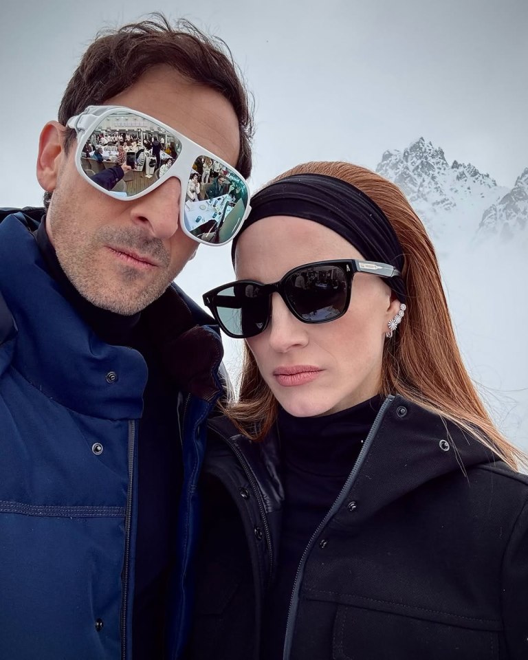 Adrien Brody and Jessica Chastain in winter clothing.