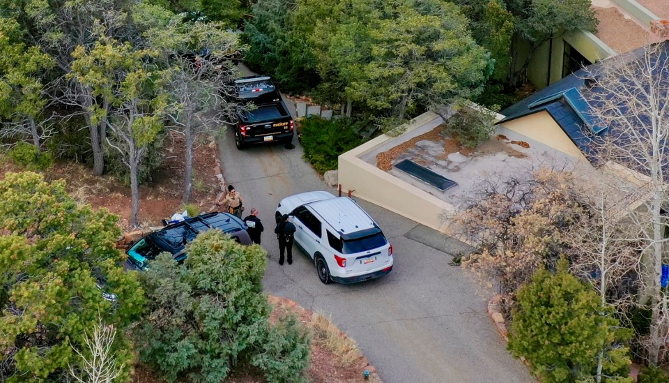 Aerial view of Santa Fe County deputies at a house.