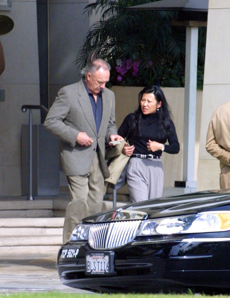 Gene Hackman and Betsy Arakawa are seen outside.