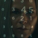 Harmony Cobel with NDR numbers super imposed on her face on Severance