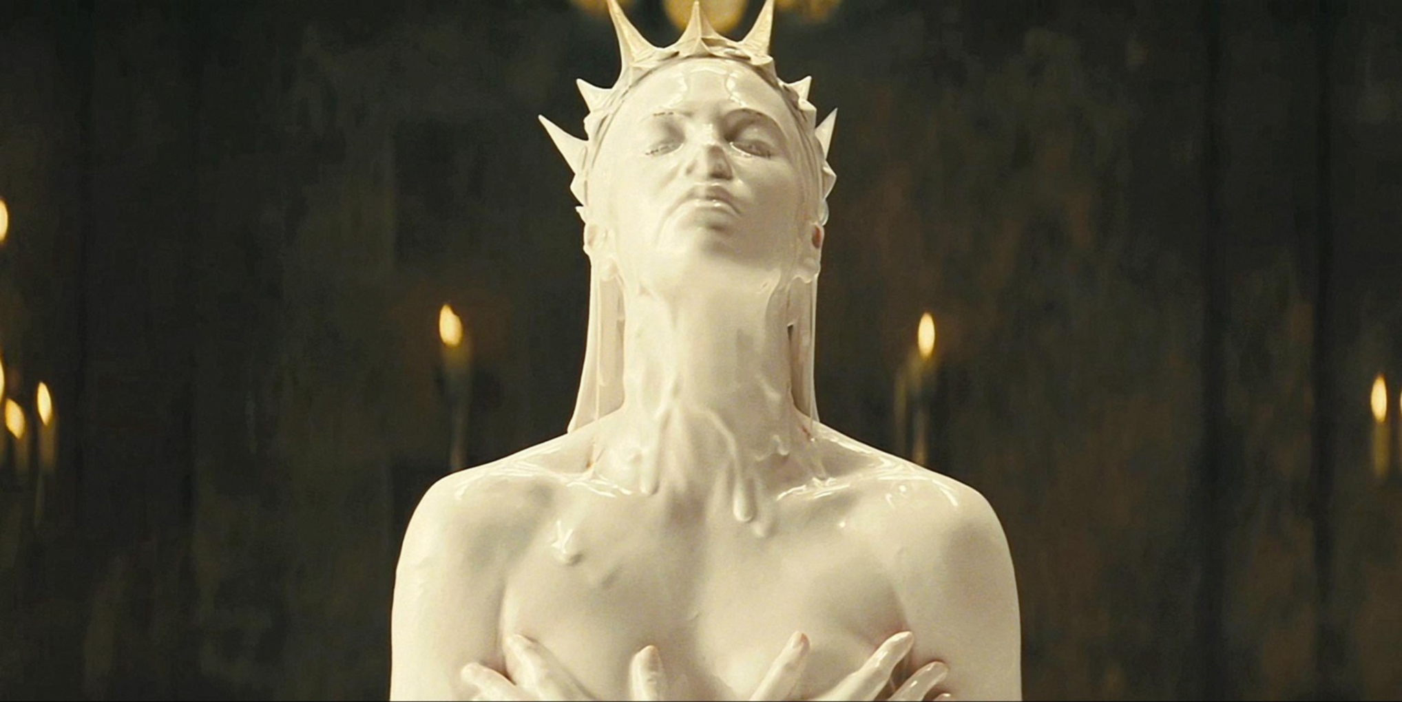 The Evil Queen, as played by Charlize Theron, emerging from a bath of white… something. From Snow White and the Huntsman