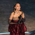 Zoe Saldana accepts the Best Actress In A Supporting Role award Emilia Perez