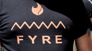 attendee wears a Fyre Festival shirt