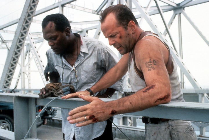 Samuel L. Jackson and Bruce Willis standing on a bridge, looking down in a scene from the film "Die Hard: With a Vengeance," 1995.