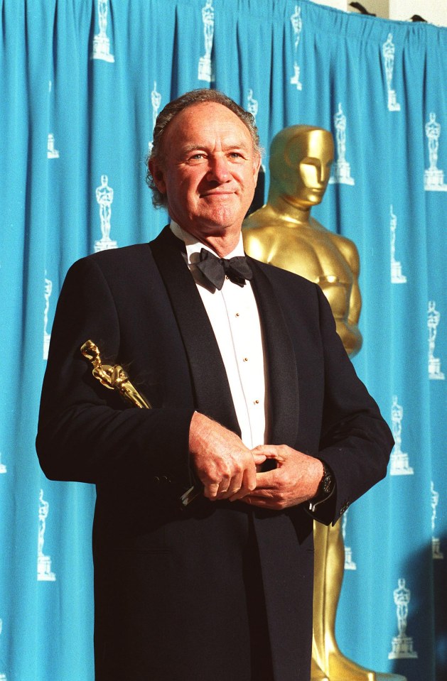 Gene Hackman holding an Academy Award.