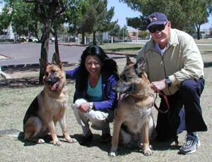 Gene Hackman with his wife and two German Shepherds.