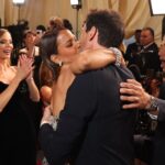 Halle Berry and Adrien Brody kissing at the Academy Awards.