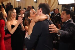 Halle Berry and Adrien Brody kissing at the Academy Awards.