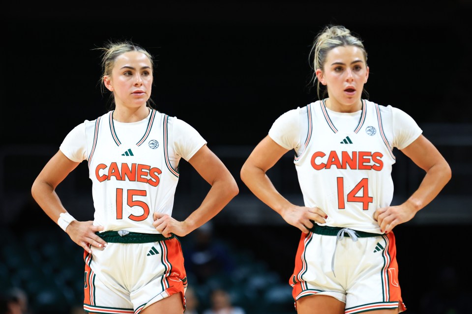 Miami Hurricanes basketball players Hanna Cavinder (#15) and Haley Cavinder (#14).