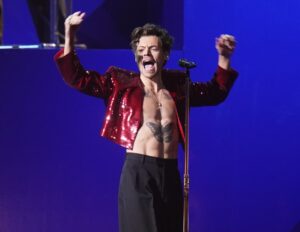 Harry Styles performing on stage.