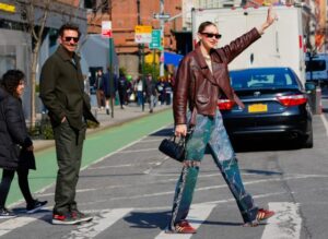 Gigi Hadid and Bradley Cooper hailing a cap in NYC