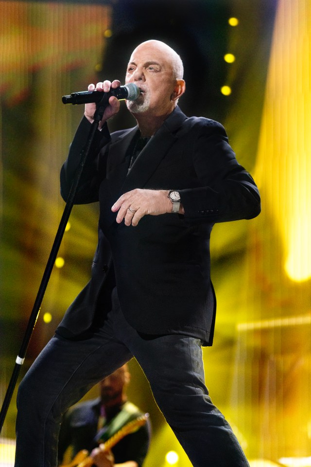 Billy Joel performing on stage.